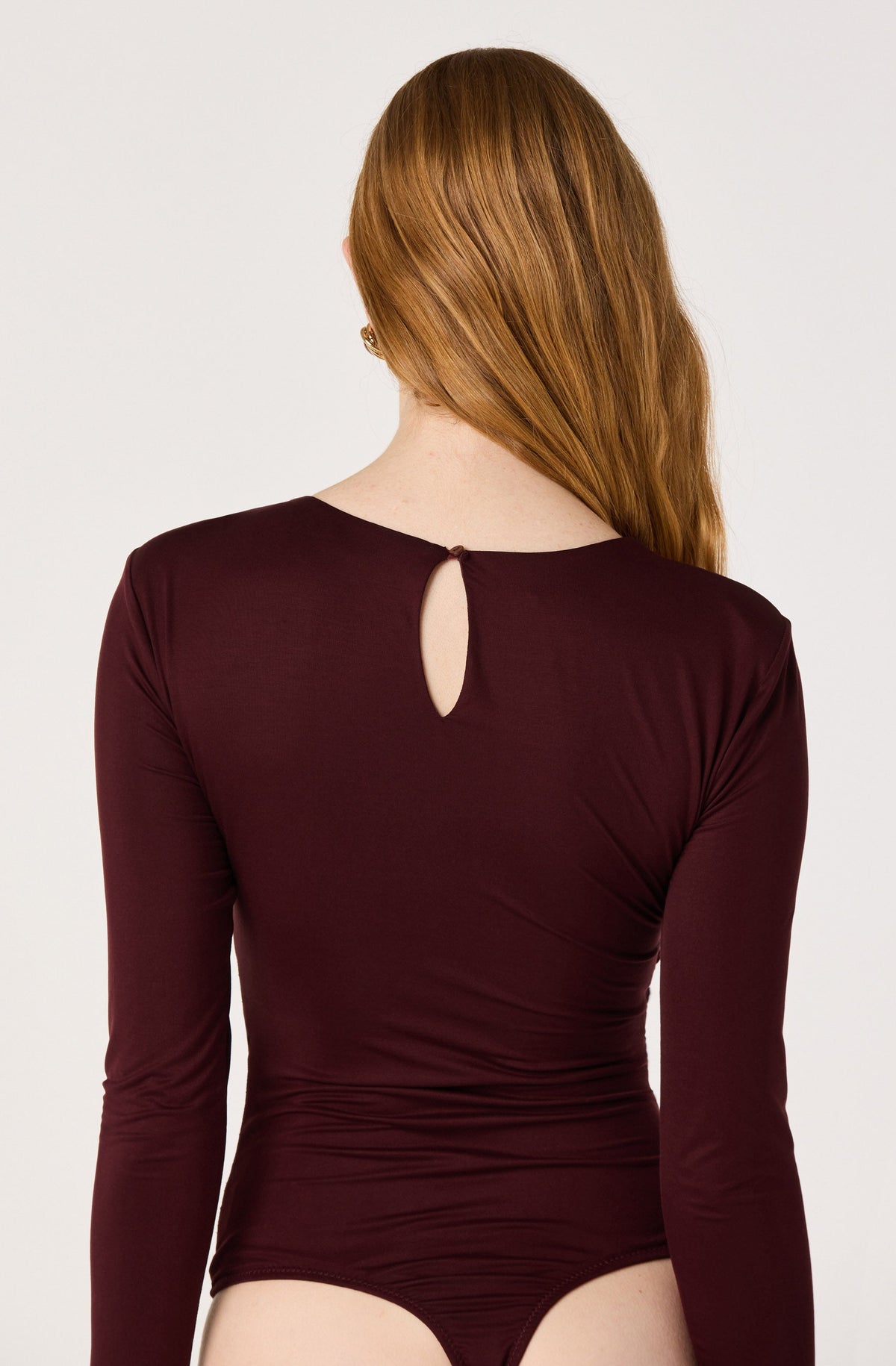 Ciarda Ruched Faux Wrap Bodysuit