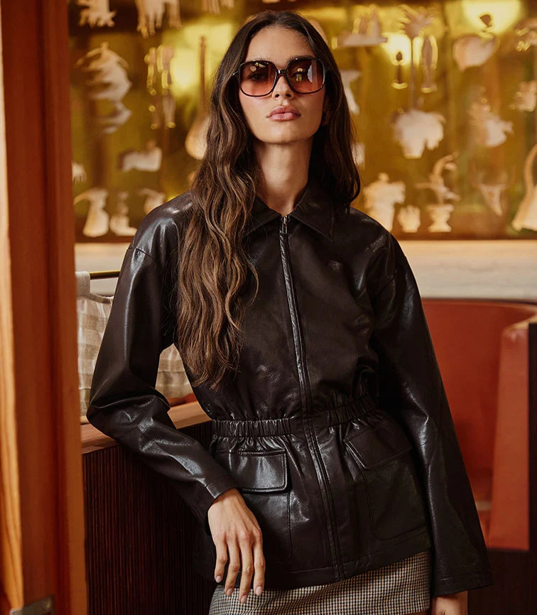Model wearing black outerwear